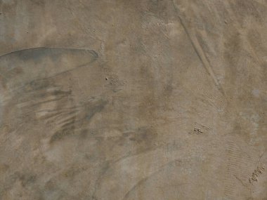 Gri beton duvarın kabataslak dokusu, kahverengi ve beyaz soyut arkaplan.