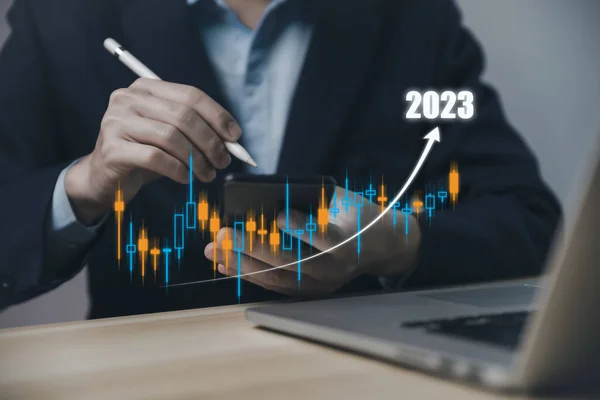 Businessman planning digital stock market analysis strategy showing positive technology chart Effective investment concept, exchange rate, economic development, stock growth and business success goals