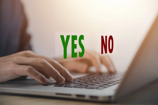 Businessman using laptop showing right and wrong sign have an idea to decide to vote think yes or no Business options for difficult situations true and false symbol