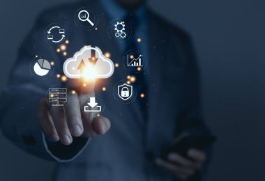 Businessman holding a light bulb showing a diagram of Cloud computing information technology icon. Concept of big data digital connection on communication networks. storage security internet service