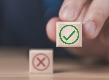 wooden block showing right and wrong sign decision concept, vote and think yes or no Business options for difficult situations true and false symbol