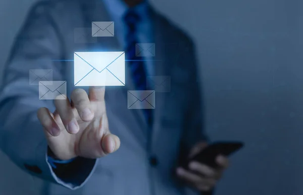Businessman sending a letter from a smartphone. electronic mail concept is online communication on the Internet network Receiving and sending information or messages in digital technology
