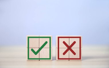 wooden block showing right and wrong sign decision concept, vote and think yes or no Business options for difficult situations true and false symbol