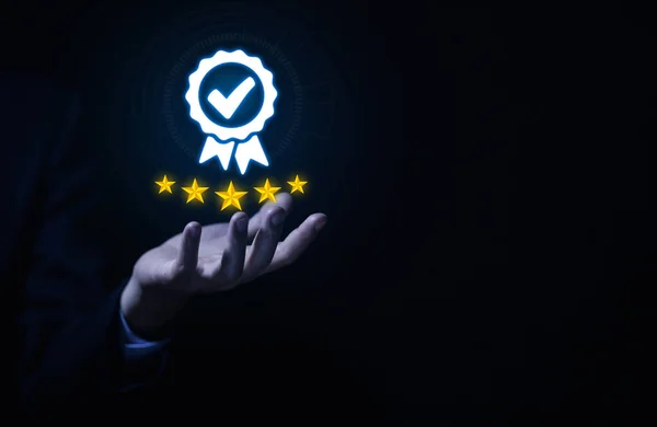 Businessman hand showing Best quality check mark digital technology icon symbol.  assurance service concept, product performance assurance, and industry-leading ISO certification.