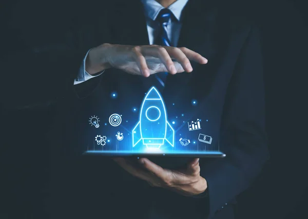 tablet Shows a rocket and an icon. Concept of Startup Business, Entrepreneurship Idea, and Online Digital Business. network connection on the interface Marketing, Technology, and Success