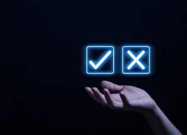 Businessman hand showing right and wrong symbol The idea is to decide to vote. Think yes or no decisions, and business options for difficult situations. true and false symbols agreeing