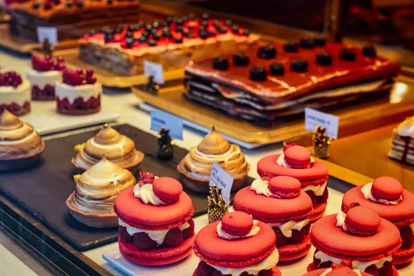 stock image variety of sweet delicious cakes in the cafe window