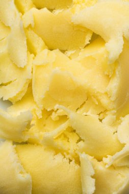 Küçük parçalanmış donmuş sarı yağ parçalarının dokusu. Yemek kitabı için arkaplan