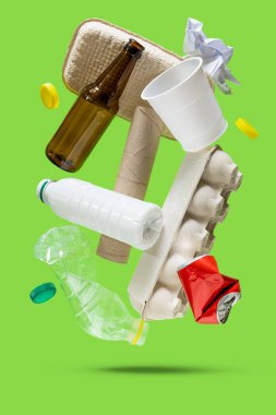 Recycling concept - levitation of recyclable materials on bright background. High quality photo