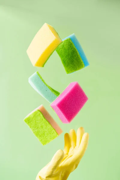 Cleaning Concept Levitation Dishwashing Sponges Green Background Copy Space — стоковое фото