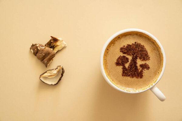 Mushroom coffee concept - mushroom shaped art on coffee cup. High quality photo