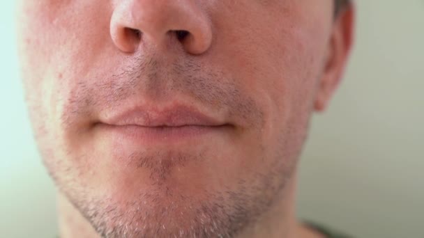 Movember Concept Male Holding Black Moustache Showing Tongue Closeup — Stock Video