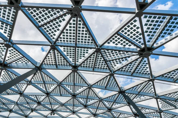 Glass metal framed roof of a modern building. Abstract architectural background.