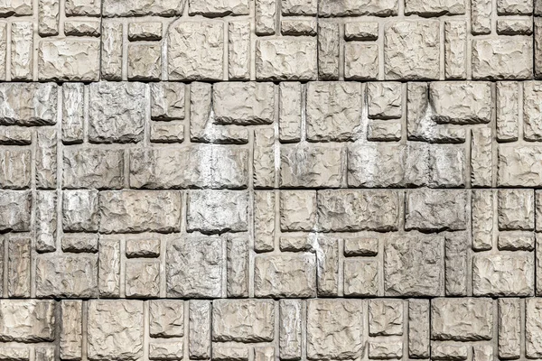 Texture of a wall covered with decorative brick-like tiles. Abstract background for design.