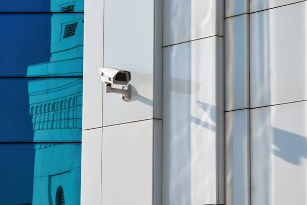 Security control camera or CCTV on a white wall.