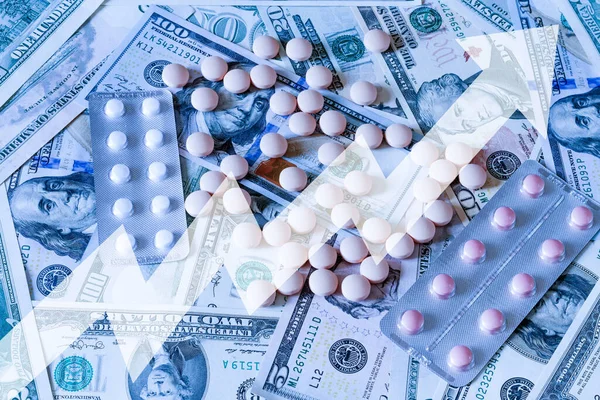 Medicine pills or capsules with dollars and arrow up. The concept of growth in the production of medicine pills or prices for them. Growth in sales, demand and purchases of a pills.