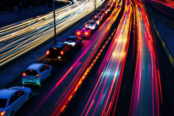 Car traffic light at night city highway.