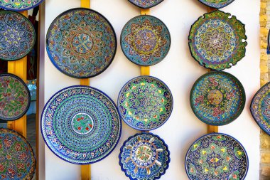 Arabic painted ceramic plates hanging on the wall.