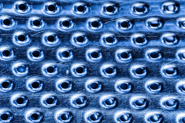 stock image Texture of a stainless steel washing machine drum with holes.