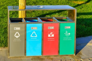 Iron multi-colored containers for separate waste collection. Waste recycling.