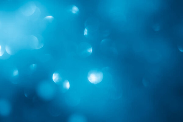 Turquoise lights abstract bokeh background. Blue lights.