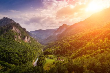 High mountains of Tara river canyon at sunset with cloudy sky. Durmitor National Park, Montenegro.