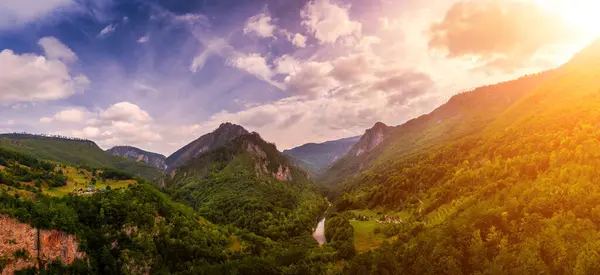 stock image Panorama of high mountains of Tara river canyon at sunset with cloudy sky. Durmitor National Park, Montenegro.