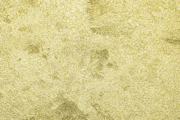 Texture of golden decorative plaster or concrete. Abstract gold grunge background for design.