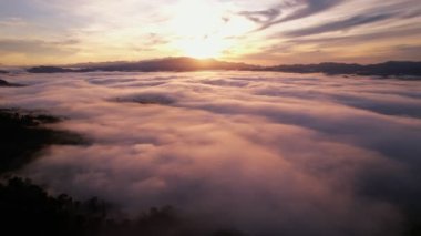  High angle view drone view of fog in rainy season over mountains,Beautiful sunrise sky clouds for create nature video scene. 4K High quality footage