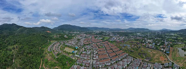 New development real estate. Aerial view of residential houses and driveways neighborhood during day time,Tightly packed homes,Panorama view over private houses in phuket thailand
