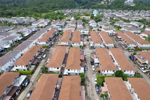 New development real estate. Aerial view of residential houses and driveways neighborhood during a fall sunset or sunrise time.Tightly packed homes.Top down view over private houses in phuket thailand