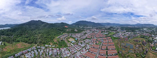 New development real estate. Aerial view of residential houses and driveways neighborhood during day time,Tightly packed homes,Panorama view over private houses in phuket thailand