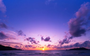 Landscape Long exposure of majestic clouds in the sky sunset or sunrise over sea with reflection in the tropical sea.Beautiful cloudscape scenery.Amazing light of nature Landscape nature background