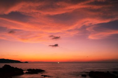 Landscape Long exposure of majestic clouds in the sky sunset or sunrise over sea with reflection in the tropical sea.Beautiful cloudscape scenery.Amazing light of nature Landscape nature background