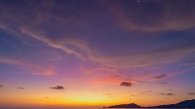 Time lapse of Majestic sunset light sky over sea landscape,Amazing light of nature cloudscape sky