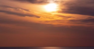 Time lapse of Majestic sunset light sky over sea landscape,Amazing light of nature cloudscape sky
