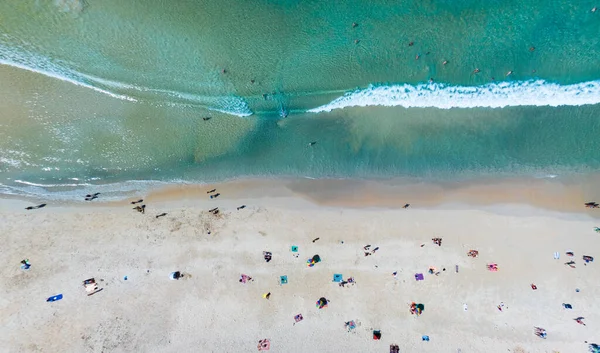 Aerial View Amazing beach with travel people relaxation on the beach,Beautiful sea in summer season at Phuket island Thailand,Travel people on beach,Beach during summer with many resting people