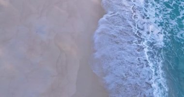 Sea waves crashing on sandy shore water surface,Amazing waves sea nature and travel background, Aerial view ocean beach background