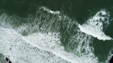 Amazing nature Beautiful texture of big power dark waves in the ocean,Aerial top view footage of motion waves crashing on sandy shore,High quality 4-K Footage nature sea background