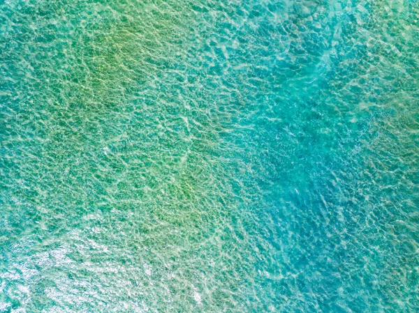 Top view Sea surface aerial view,Bird eye view photo of turquoise waves and water surface texture, Blue sea background, Beautiful waves nature, Amazing view seascape