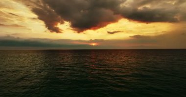 Sea in sunset or sunrise sky Summer season colorful clouds and dark sea sky footage from drone aerial view High quality