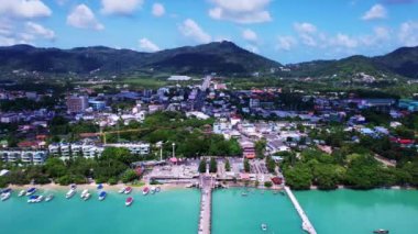 Aerial view Drone hyperlapse of Yacht and sailboat in the pier, Chalong bay Phuket thailand,Amazing sunny sky clouds over sea,Timelapse sky sunny day time