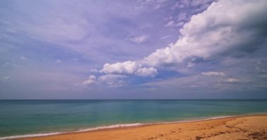 Timelapse nature landscape of Beach sea and clouds moving in the blue sky in good weather day.Sunlight reflected on the sea surface.Clouds traveling over the wide space of clear blue sky background