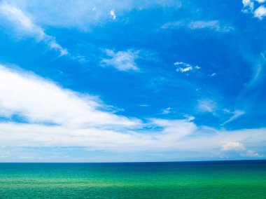 Aerial view of a blue sea surface water texture background,Sun reflections over ocean, Aerial flying drone view Waves water surface texture on sunny tropical ocean in Phuket island Thailand