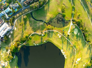 Aerial view drone shot of beautiful green golf field at Phuket island Thailand,Wide angle Top view golf course
