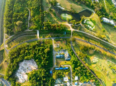 Aerial view drone shot of beautiful green golf field at Phuket island Thailand,Wide angle Top view golf course