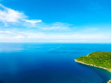 Aerial view of a blue sea surface water texture background,Sun reflections over ocean, Aerial flying drone view Waves water surface texture on sunny tropical ocean in Phuket island Thailand