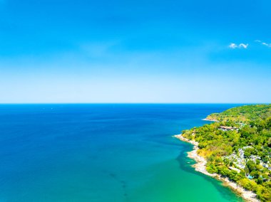 Aerial view of a blue sea surface water texture background,Sun reflections over ocean, Aerial flying drone view Waves water surface texture on sunny tropical ocean in Phuket island Thailand