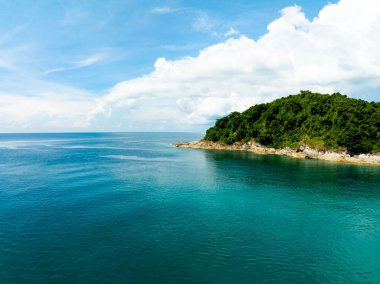 Aerial view of a blue sea surface water texture background,Sun reflections over ocean, Aerial flying drone view Waves water surface texture on sunny tropical ocean in Phuket island Thailand