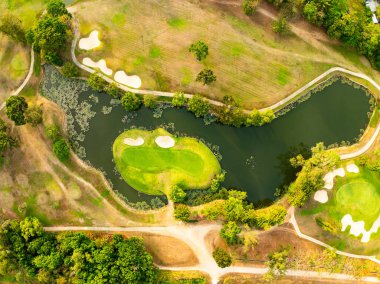 Aerial view drone shot of beautiful green golf field at Phuket island Thailand,Wide angle Top view golf course